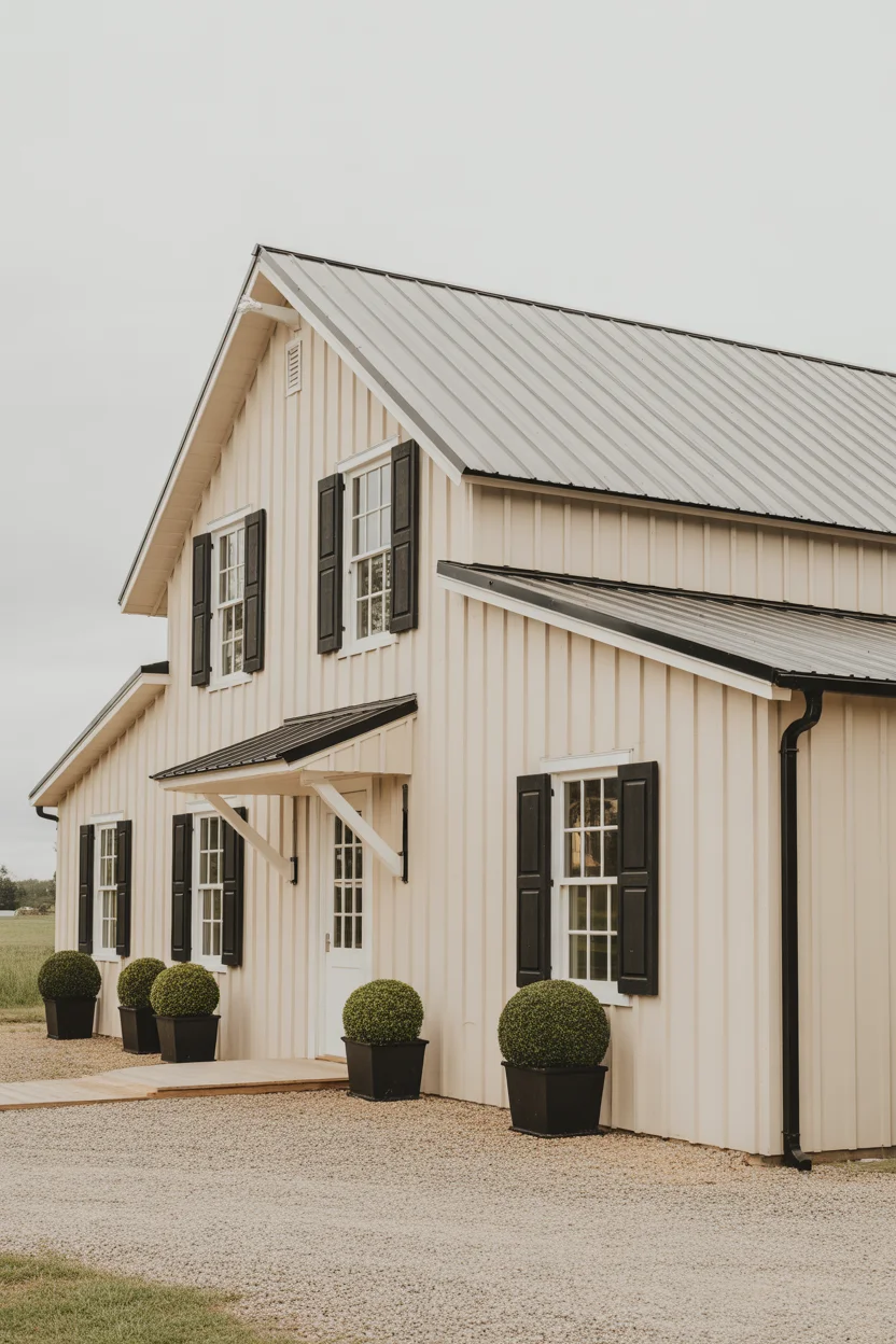 Warm Cream Board and Batten With Black Standing Seam Roof