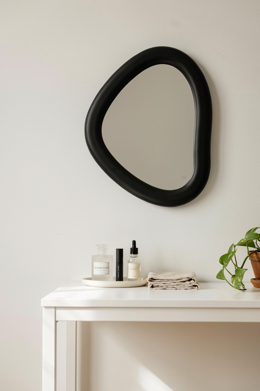 Postmodern Squiggle Mirror Above a Tidy Vanity